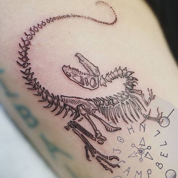 Jurrasic Park Themed - Velociraptor Dinosaur Skeleton Tattoo at Sacred Mandala Studio in Durham, NC by Tattoo Artist John Campbell